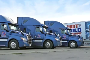 A Fleet of ET Transport trucks ready for cross-border freight services