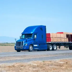 Flatbed trailer along a highway